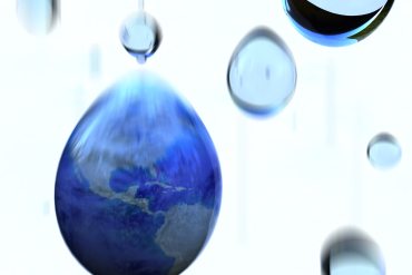 Water droplets with the world inside one of them.